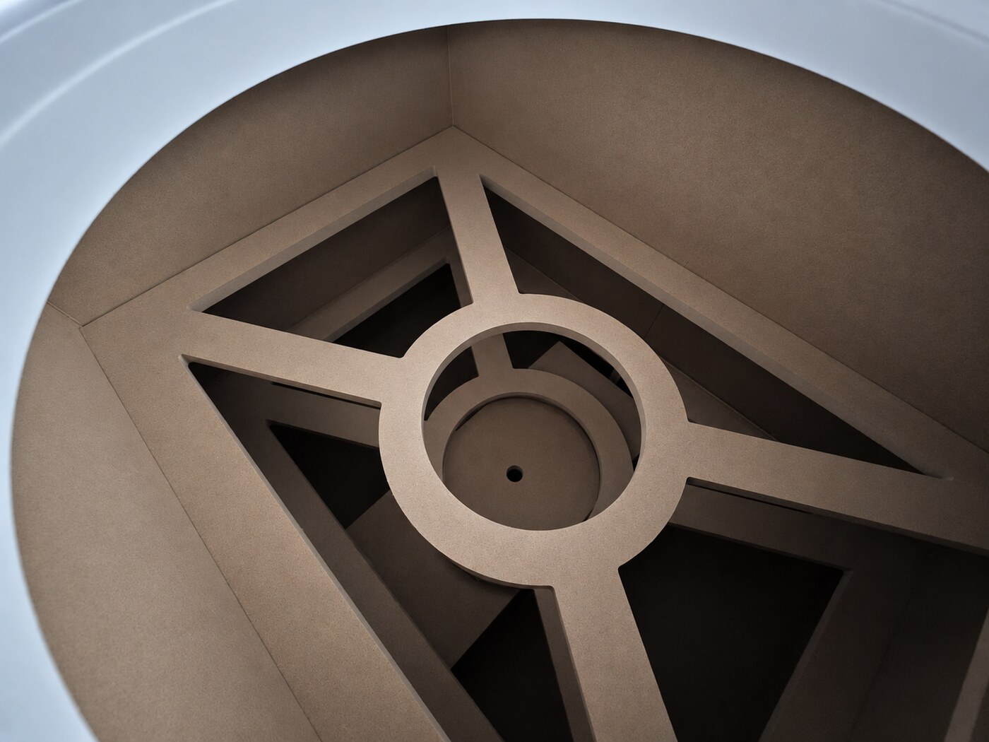 The star-hub brace inside a primed XOP cabinet, locking all four walls at the driver's centre of mass